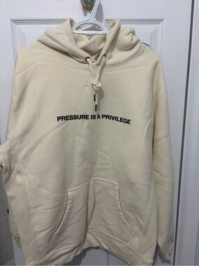 Cream Pullover Hoodie with 'Pressure Is A Privilege' Chest Print
